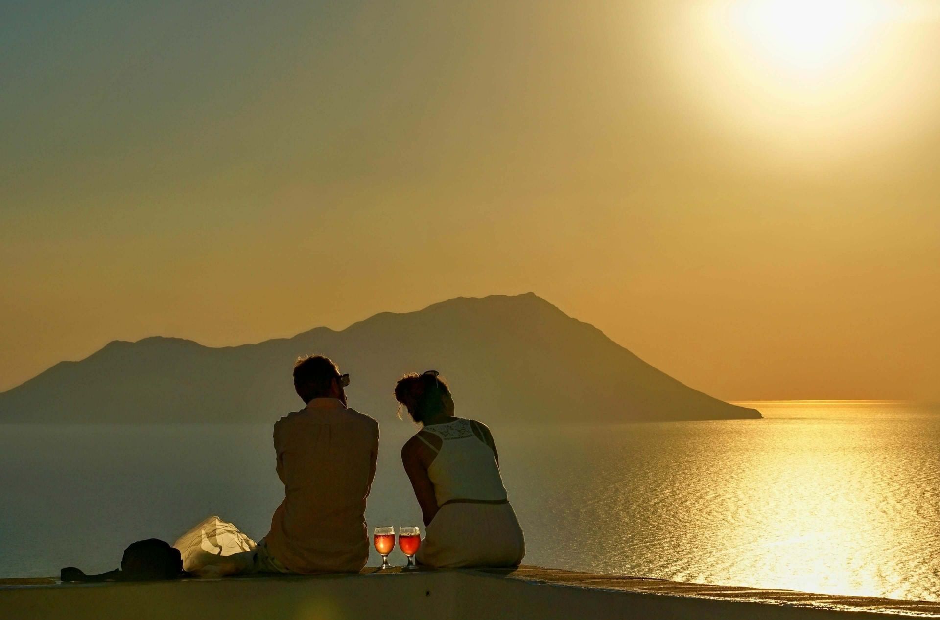 Couple enjoying the sunset on Milos Island
